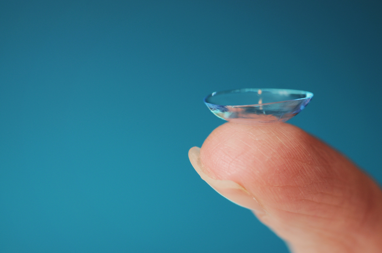 Holding a contact lens on finger tip